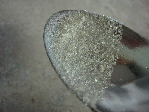 Raw sugar on a spoon by Ayelie
